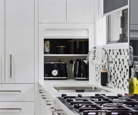 stone splashback behind gas cooktop